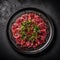 Beef Carpaccio On A Black Ornate Round Smooth Plate, French Dish. Generative AI