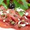 Beef carpaccio with pepper, rucola and parmesan