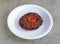 beef chappal kabab served in plate isolated on grey background top view of pakistani and indian spices food