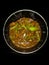 Beef chilli dry a famous Chinese food in my kitchen with Black background