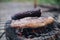 Beef and corn grilled on a charcoal stove. Barbecue hamburger