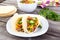 Beef corn soft taco on rustic wood table