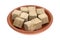 Beef flavored bouillon cubes in a bowl side view