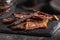 Beef jerky meat. Dried sliced meat on cuting board