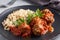 Beef meatballs and brown rice on a plate. Ready made portioned dish meat with garnish