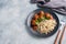 Beef meatballs and brown rice on a plate. Ready made portioned dish meat with garnish. Copy space