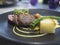 Beef Medallions topped with Watercress, Potato Gratin, Broccoli and BÃ©arnaise Sauce