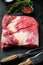 Beef navel, raw beef brisket meat,with ingredients for smoking  making  barbecue, pastrami, cure, on black stone background