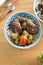 Beef noodle soup. Taiwanese famous food in a bowl on wooden table