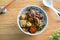 Beef noodle soup. Taiwanese famous food in a bowl on wooden table