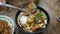 Beef noodles chili sauce served in a bowl on table top view of taiwanese food. Soup beef noodle in a bowl on wooden table. Chinese