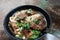 Beef noodles chili sauce served in a bowl on table top view of taiwanese food. Soup beef noodle in a bowl on wooden table. Chinese