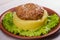 Beef and pork patty with smashed potato and lettuce