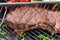 Beef ribeye steak grilling on flaming grill rich food