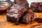 beef ribs with bbq sauce glazed over them