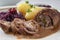 Beef roulade with red cabbage, potatoes and sauce, german meat r