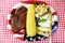 Beef steak, corn, salad and baked potato