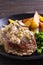 Beef steak diane with mushroom and leek cream sauce, potato fries and green peas