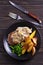 Beef steak diane with mushroom and leek cream sauce, potato fries and green peas