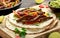 Beef Steak Fajitas with tortilla mix pepper, onion and avocado on wooden board