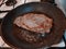 Beef steak in a frying pan