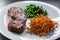 Beef steak with green peas and sweet potato