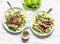 Beef steak with mashed potatoes and creamy green peas sauce on light background, top view