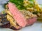 Beef steak with mustard herb crust and romaine lettuce hearts wi