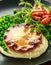 Beef steak pies with rich onion gravy served with sweet peas and salad