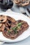 Beef steak with sauteed brown mushrooms and thyme, vertical