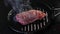 beef steak steaming cooking in a pan on an induction plate