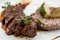 beef steak and wheat risotto in a plate at restaurant