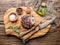 Beef steaks with spices on a wooden tray