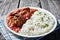 Beef Stew with rice on a white plate