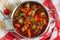 Beef tail stew with vegetables, thyme, red wine