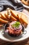 Beef tartare with red onion toast bread and garlic