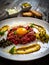 Beef tartare steak with onion, capers and pickled cucumbers on wooden table