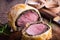 Beef Wellington, classic steak dish on cutting board