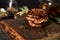 Beef, zucchini and cheddar cheese patties or cutlets on wood board. Low key food photo, dark background. Dinner meat