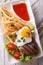 Beefsteak, fried egg and potatoes on a plate closeup. vertical t