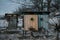 Beehives covered with snow in wintertime in the frosty dawn or the sunset