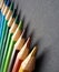 Beeing creative! Colorful pencils with over black background.