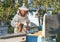 Beekeeper on apiary. pulling frame from the hive