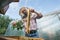 Beekeeper cleans the honeycomb from the bees with a bunch of mint