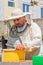 Beekeeper collecting honey