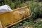 Beekeeper hands with protective glove holds bee hive frame on sunny day in apiary