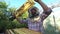 Beekeeper holding a honeycomb full of bees closeup