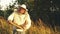 Beekeeper holds a honey cage with bees in his hands.