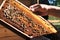 Beekeeper keeps honeycomb ,prepares harvest honey from the beehive