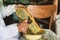 Beekeeper prepares honeycomb to extracting honey. Beekeeping